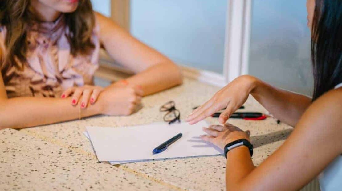attorney talking with client about answering interrogatories