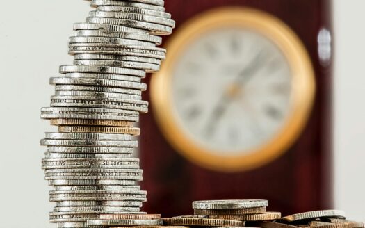 selective focus photo of stacked coins